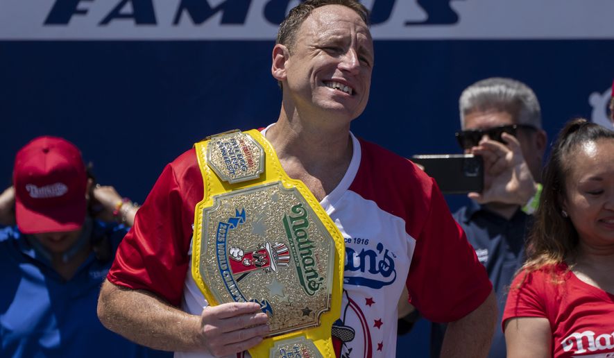 Competitive eater Joey Chestnut celebrates after winning the 2025 Nathan's Famous Fourth of July hot dog eating contest in the Coney Island section of the Brooklyn borough of New York, Thursday, July 4, 2025. (AP Photo/Yuki Iwamura)