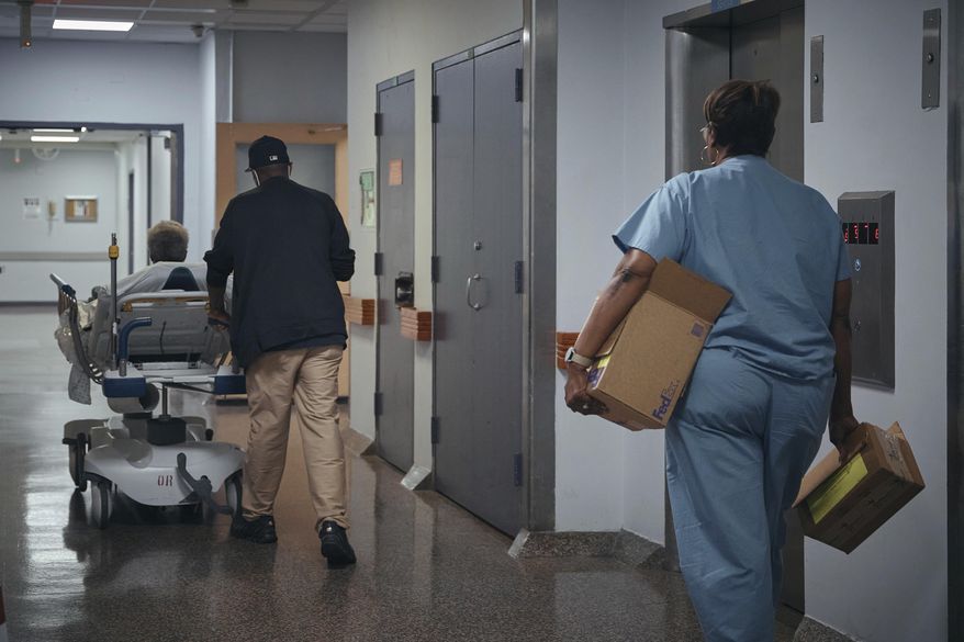 A nurse transports a patient on a stretcher inside Brookdale University Hospital and Medical Center on Tuesday, July 1, 2025, in the Brooklyn borough of New York. (AP Photo/Andres Kudacki) **FILE**