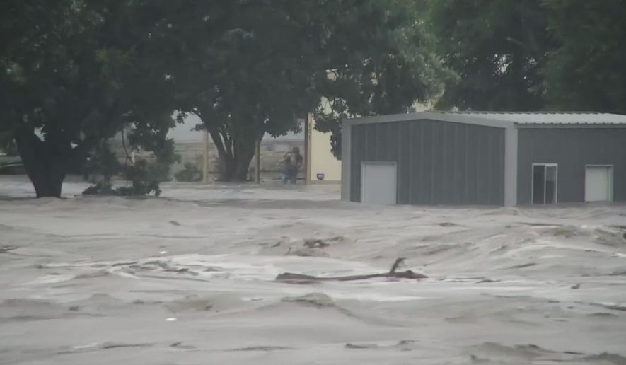Water rises from severe flooding along the Guadalupe River.in Kerr County, Texas on Friday, July 4, 2025. (KSAT via AP)