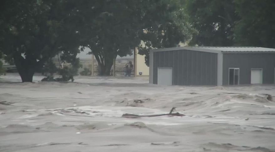 Water rises from severe flooding along the Guadalupe River.in Kerr County, Texas on Friday, July 4, 2025. (KSAT via AP)