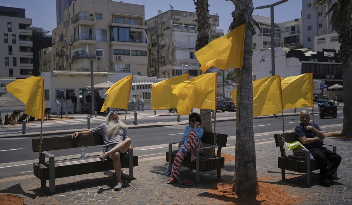 NextImg:Israeli airstrikes kill 14 Palestinians in Gaza and another 10 die seeking food