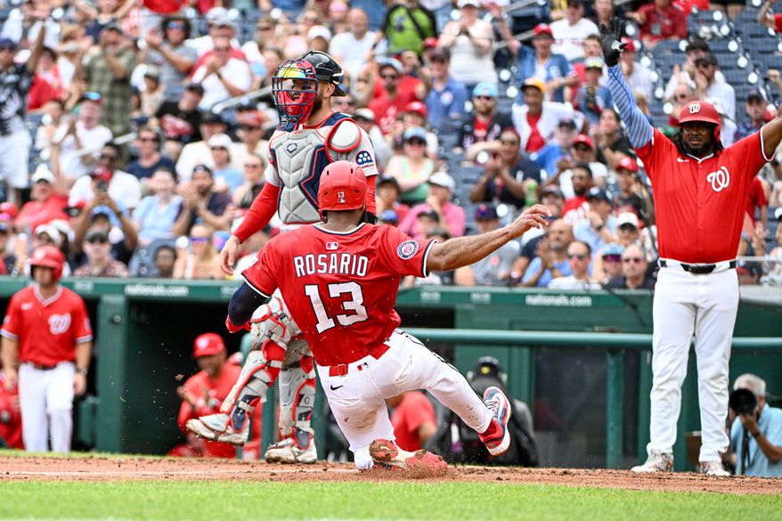 Washington Nationals second baseman Amed Rosario (13) sliding in home safely to score on Paul DeJong’s double during the third inning of an MLB game against the Boston Red Sox at Nationals Park in Washington D.C., July 6, 2025. (Photo by All-Pro Reels for Washington Times Sports)