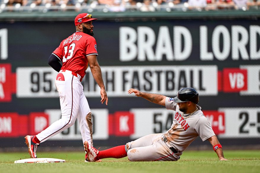 Washington Nationals second baseman Amed Rosario (13) throwing to first to complet a double play as Boston Red Sox first baseman Abraham Toro (29) slides into second during the sixth inning of an MLB game at Nationals Park in Washington D.C., July 6, 2025. (Photo by All-Pro Reels for Washington Times Sports)
