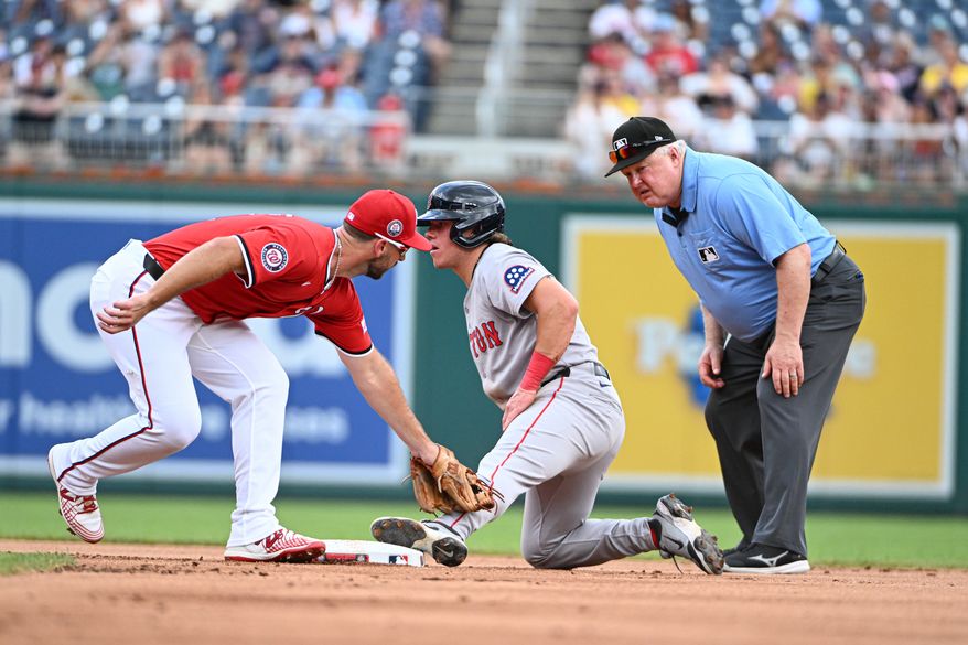 Boston Red Sox third baseman Nathan Eaton (40) slides into second safely with a stolen base ahead of the tag by Washington Nationals shortstop Paul DeJong (14) during the first inning of an MLB game at Nationals Park in Washington D.C., July 6, 2025. (Photo by All-Pro Reels for Washington Times Sports)