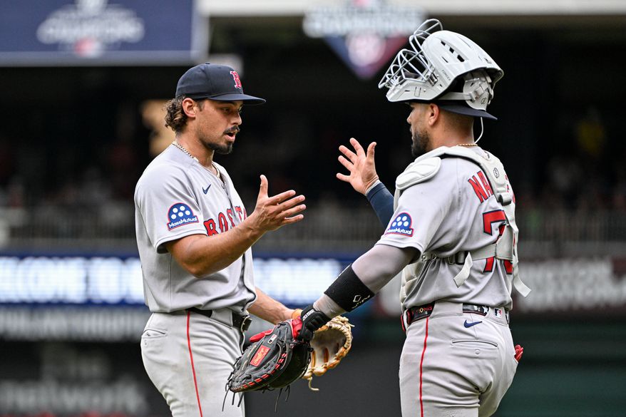 Boston Red Sox relief pitcher Jordan Hicks (46) shaking hands with catcher Carlos Narvaez (75) after picking up the save in the team’s 6-4 win over the Washington Nationals at Nationals Park in Washington D.C., July 6, 2025. (Photo by All-Pro Reels for Washington Times Sports)