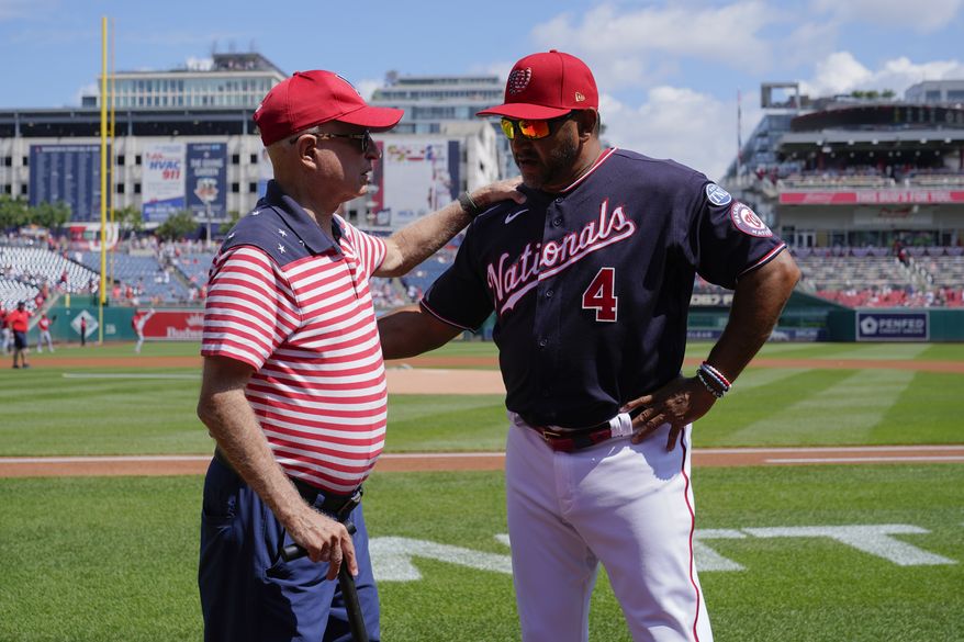 Washington Nationals principal owner Mark Lerner, left, chats with Nationals manager Dave Martinez before a baseball game between the Nationals and the Cincinnati Reds, Tuesday, July 4, 2023, in Washington. (AP Photo/Patrick Semansky) **FILE**