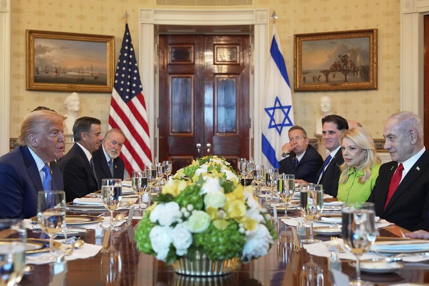 President Donald Trump, left, meets with Israel's Prime Minister Benjamin Netanyahu, right, in the Blue Room of the White House, Monday, July 7, 2025, in Washington. (AP Photo/Alex Brandon)