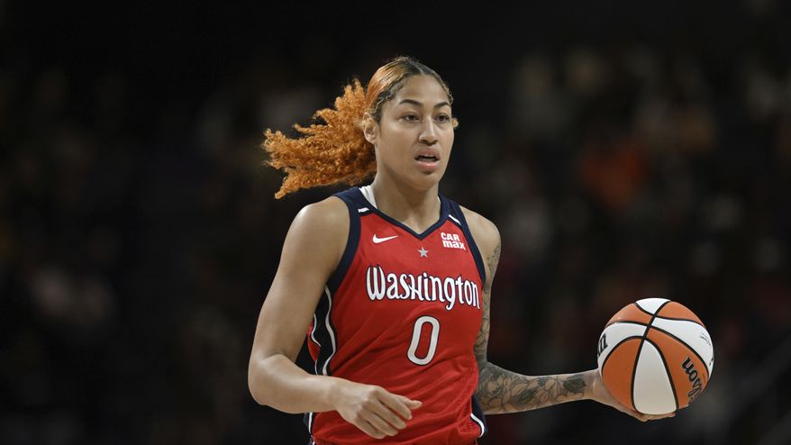 Washington Mystics center Shakira Austin (0) handles the ball during the second half of a WNBA basketball game against the New York Liberty, Tuesday, May 14, 2024, in Washington. (AP Photo/Terrance Williams) **FILE**
