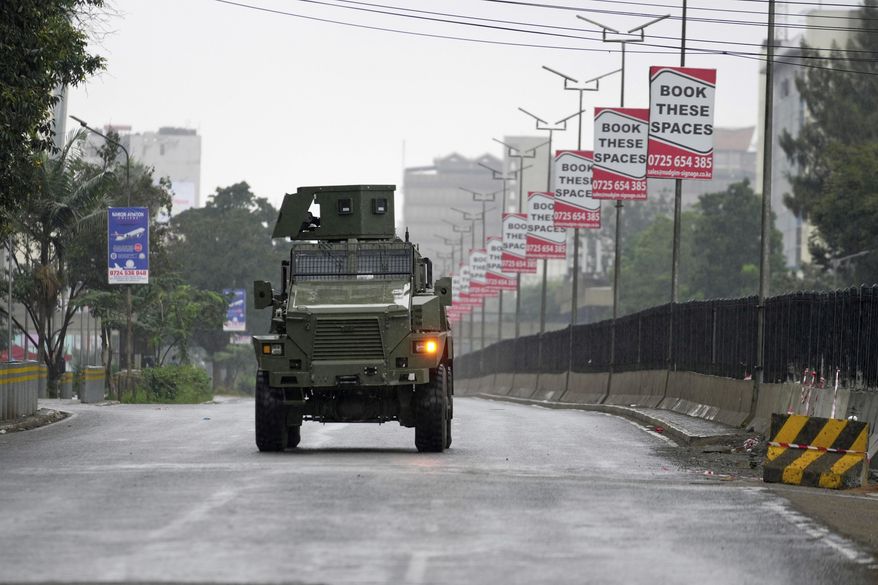 ADDITION: CLARIFIES DATE - An armed police vehicle parks on road ahead of demonstrations to mark the historic 1990 Saba Saba (a Swahili word that means seven seven) protests for democratic reforms in the Kangemi slum of Nairobi, Kenya, Monday, July 7, 2025. (AP Photo/Brian Inganga)