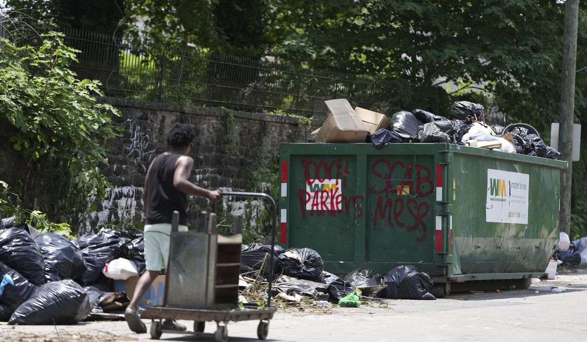 NextImg:Philadelphia workers and city reach a deal to end strike that halted residential trash pickup