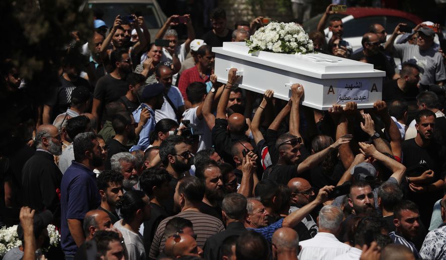 Mourners carry the coffin of a victim of the June 22 suicide bombing at Mar Elias Church during a funeral service at al-Saleeb Church in the al-Qasaa neighborhood of Damascus, Syria, June 24, 2025. (AP Photo/Omar Sanadiki)