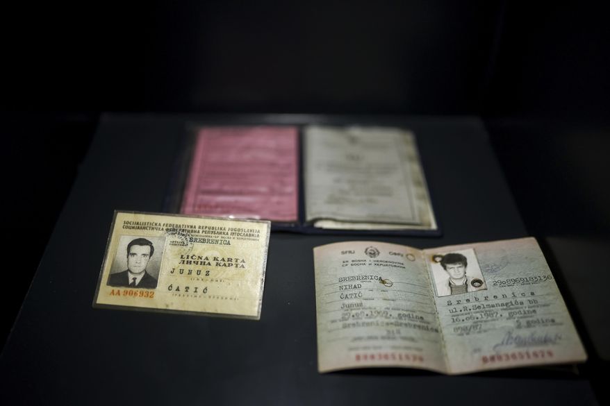 Personal documents found in a mass grave are shown as a part of the exhibition "Lives Beyond the Fields of Death" opened at the Srebrenica Memorial Center in Potocari, Bosnia, Thursday, July 10, 2025. (AP Photo/Armin Durgut)