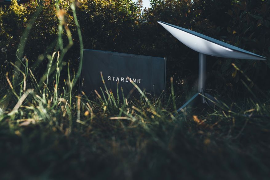 Starlink system from SpaceX being unboxed in backyard garden, Germany - Jun 16, 2023. File photo credit: Hadrian via Shutterstock.