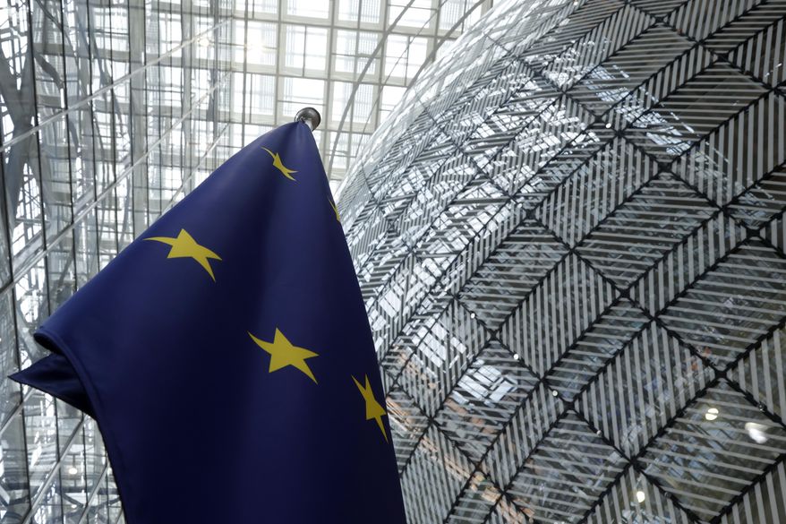 The European Union flag stands inside the atrium at the European Council building in Brussels, June 17, 2024. (AP Photo/Omar Havana, File)