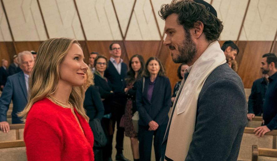 This image released by Netflix shows Kristen Bell, left, and Adam Brody in a scene from "Nobody Wants This." (Stefania Rosini/Netflix via AP)
