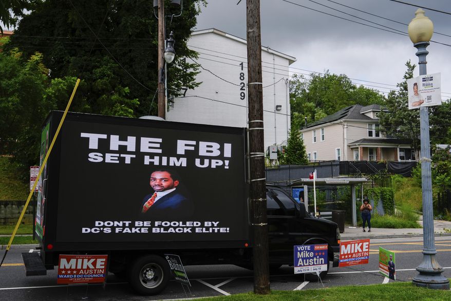 A mobile billboard truck displays a message in support of former District of Columbia Councilman Trayon White outside the Anacostia Neighborhood Library during the Ward 8 special election, Tuesday, July 15, 2025, in Washington. (AP Photo/Julia Demaree Nikhinson)