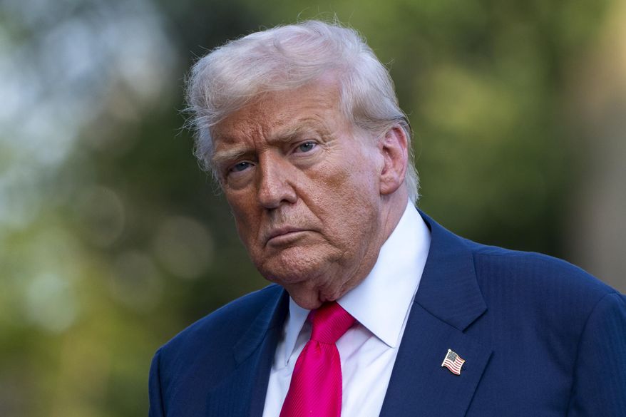 President Donald Trump walks from Marine One after arriving on the South Lawn of the White House, Tuesday, July 15, 2025, in Washington. (AP Photo/Alex Brandon)