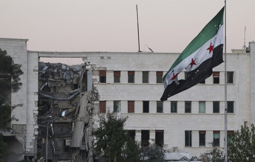 The Syrian Defense Ministry building sits heavily damaged after alleged Israeli airstrikes in Damascus, Syria, Wednesday, July 16, 2025. (AP Photo/Ghaith Alsayed)