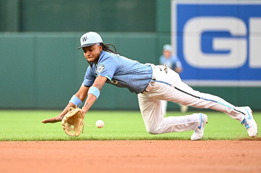 Washington Nationals shortstop C.J. Abrams (5) diving for a ball off the bat of San Diego Padres third baseman Manny Machado (13) during the first inning of an MLB game at Nationals Park in Washington D.C., July 18, 2025. (Photo by All-Pro Reels for Washington Times Sports)