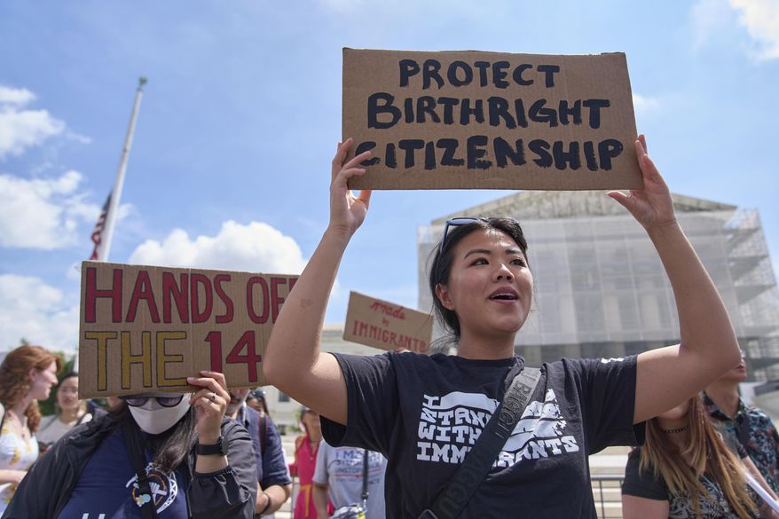 Hannah Liu, 26, of Washington, holds up a sign in support of birthright citizenship, May 15, 2025, outside of the Supreme Court in Washington. "This is enshrined in the Constitution. My parents are Chinese immigrants," says Liu. "They came here on temporary visas so I derive my citizenship through birthright." (AP Photo/Jacquelyn Martin, File)