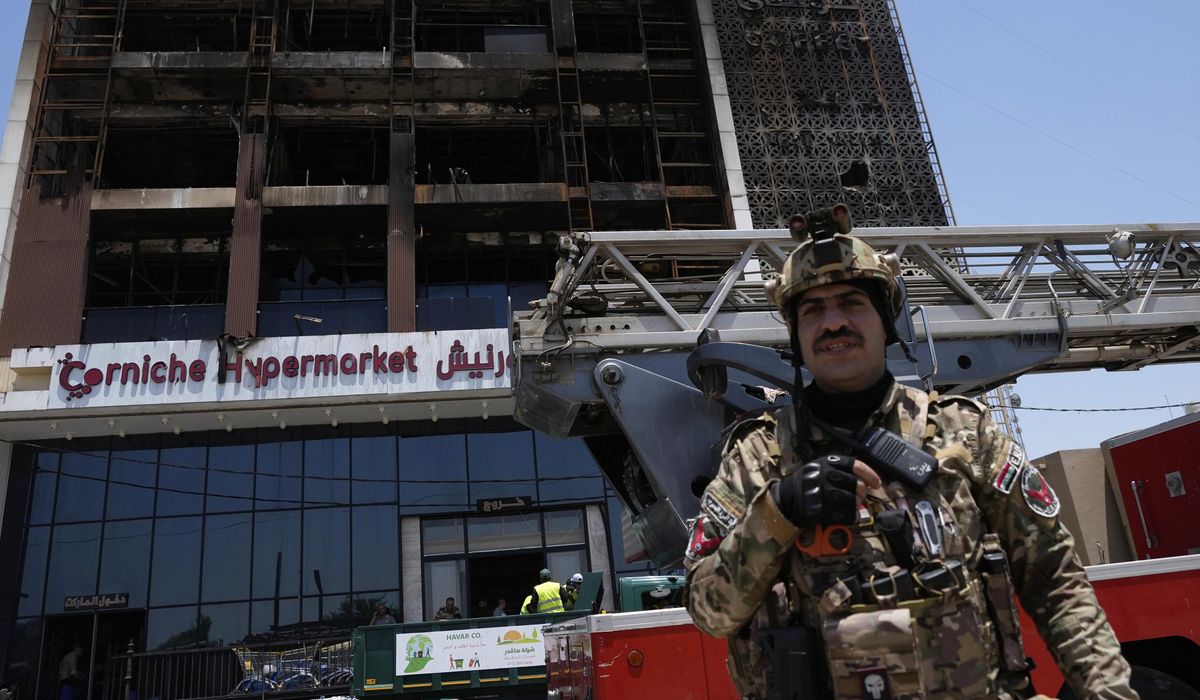NextImg:Officials try to identify 18 bodies in deadly Iraq shopping mall fire