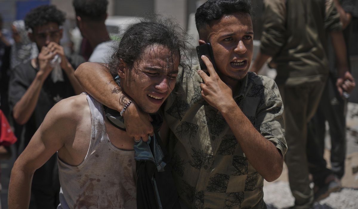 NextImg:Officials say 85 Palestinians seeking food killed as Israel widens evacuation orders