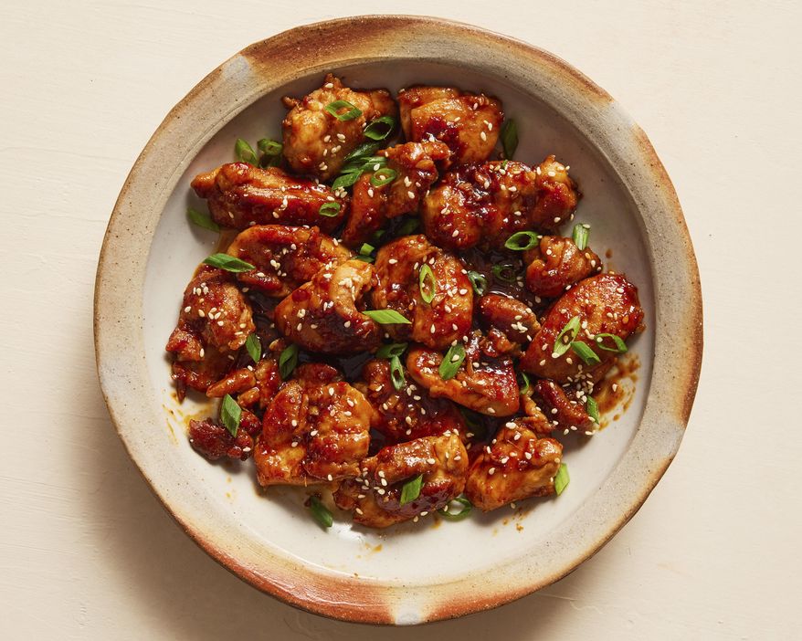 This image released by Milk Street shows a recipe for stir fried gochuhang chicken.. (Milk Street via AP)