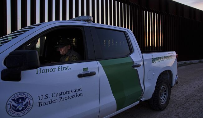 A border patrol agent works by a section of the border wall, Wednesday, June 18, 2025, in Mission, Texas. (AP Photo/Jacquelyn Martin) ** FILE **