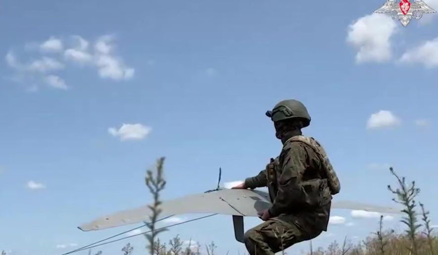 FILE - In this photo taken from video distributed by Russian Defense Ministry Press Service on July 17, 2025, a Russian serviceman operates a "Supercam" drone in an undisclosed location in Ukraine. (Russian Defense Ministry Press Service via AP, File)