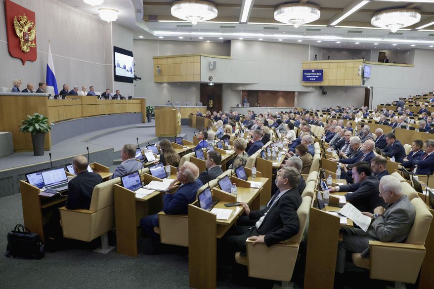 In this photo released by the State Duma, Lower House of the Russian Parliament Press Service, Deputies attend a session at the State Duma, the lower house of the Russian Parliament in Moscow, Russia, Tuesday, July 22, 2025. (The State Duma, Lower House of the Russian Parliament Press Service via AP)