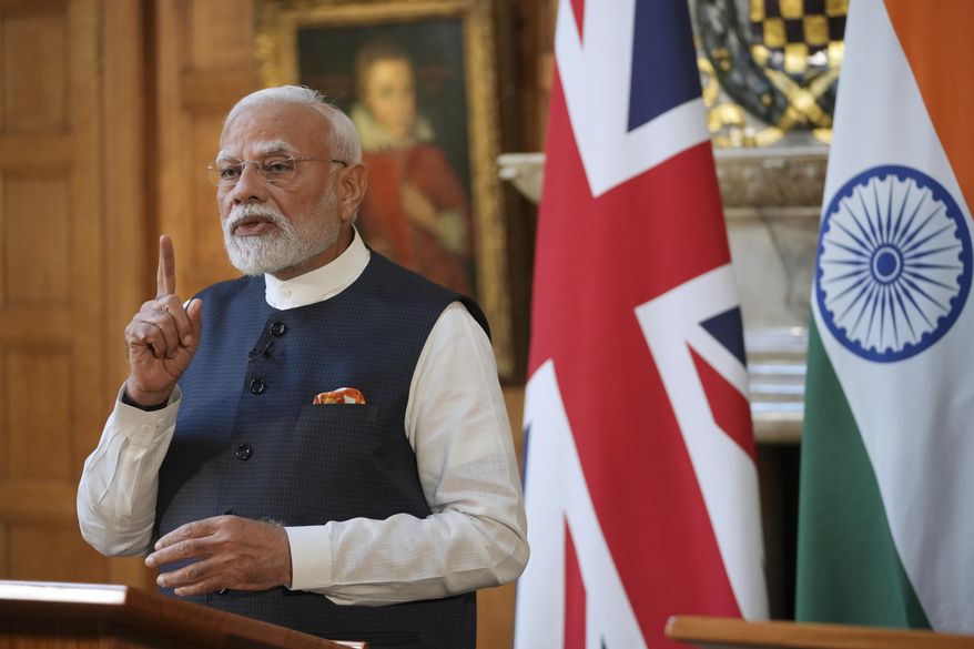 Prime Minister Narendra Modi of India gestures during a press conference with Britain's Prime Minister Keir Starmer after signing a free trade agreement at Chequers near Aylesbury, England, on Thursday, July 24, 2025. (AP Photo/Kin Cheung, Pool) **FILE**