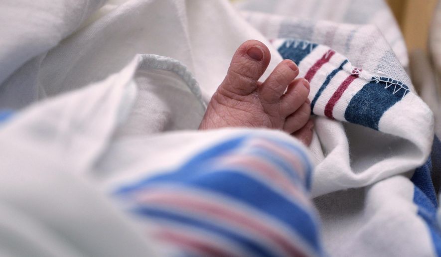 The toes of a baby are seen at a hospital in McAllen, Texas, on Wednesday, July 29, 2020. (AP Photo/Eric Gay, File)