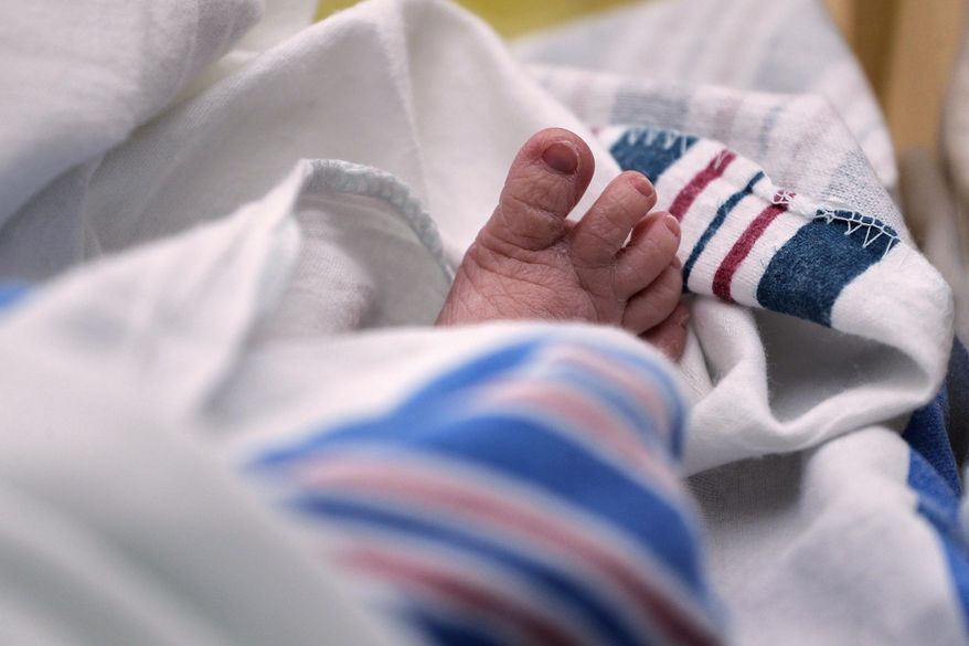 The toes of a baby are seen at a hospital in McAllen, Texas, on Wednesday, July 29, 2020. (AP Photo/Eric Gay, File)