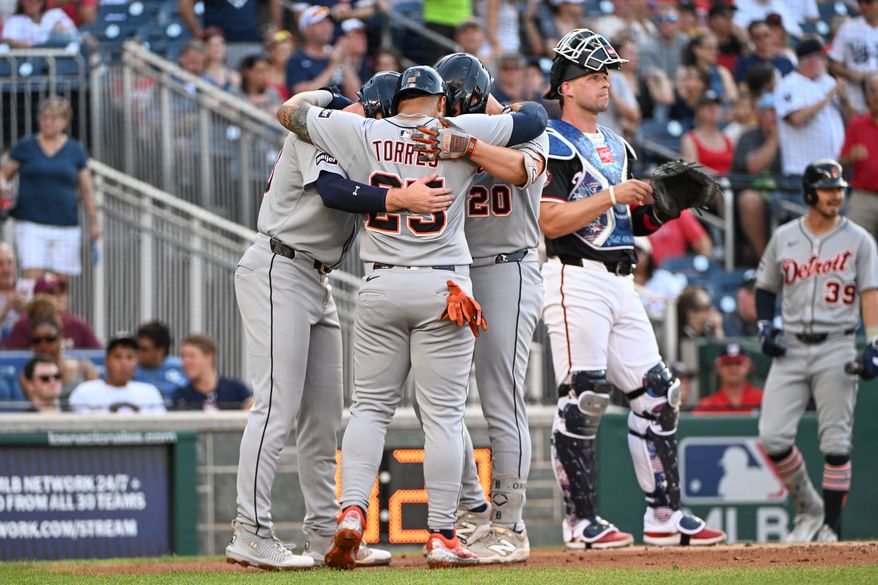 Detroit Tigers designated hitter Spencer Torkelson (20) hugging teammates Gleyber Torres (25) and Colt Keith (33) after hitting a home run during the first inning of an MLB game against the Washington Nationals at Nationals Park in Washington D.C., July 3, 2025. (Photo by All-Pro Reels for Washington Times Sports)