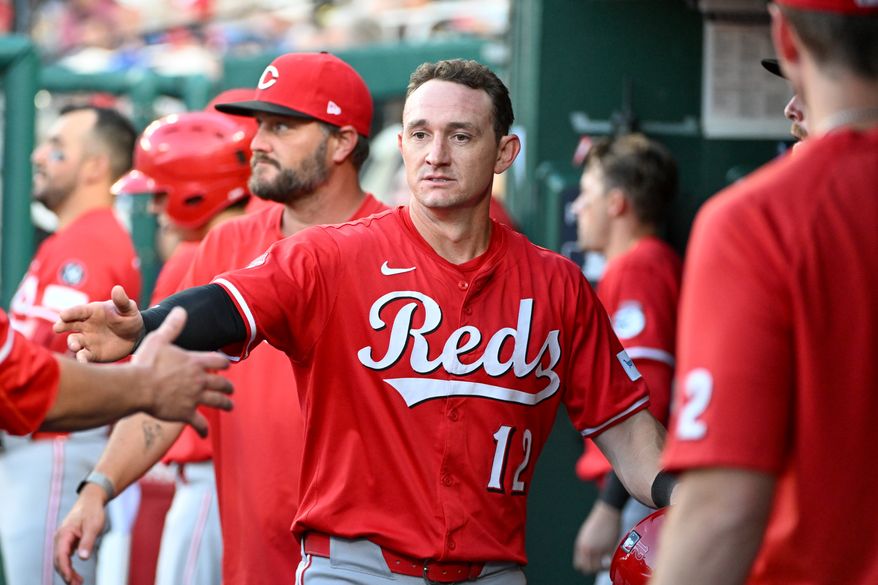 Cincinnati Reds left fielder Austin Hays (12) in the dugout after scoring on Spencer Steer’s single during the fourth inning of an MLB game against the Washington Nationals at Nationals Park in Washington D.C., July 21, 2025. (Photo by All-Pro Reels for Washington Times Sports)