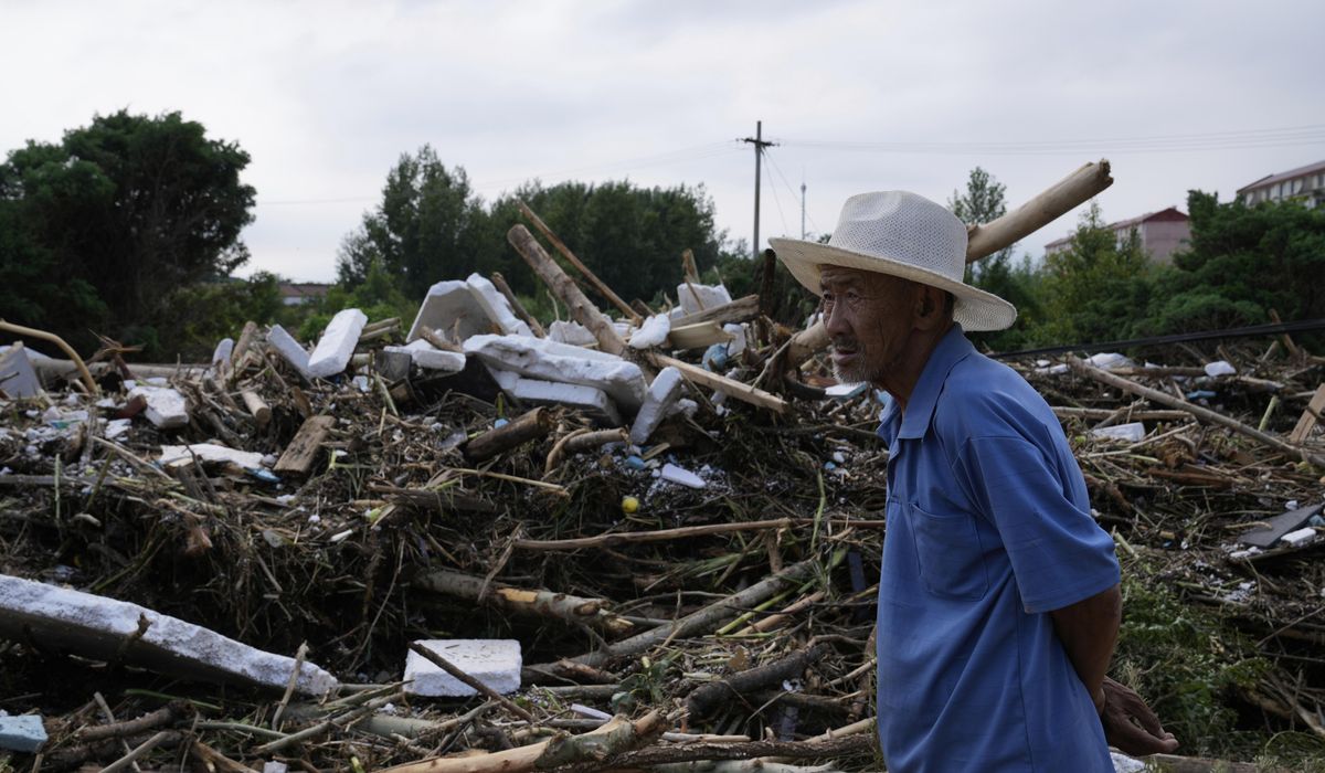 NextImg:30 people die in heavy rains and flooding in Beijing, Chinese state media say