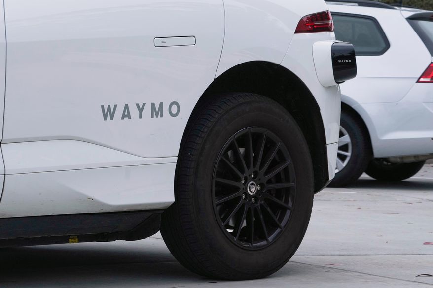 A Waymo vehicle drives in San Francisco on Thursday, July 3, 2025. (AP Photo/Jeff Chiu) **FILE**
