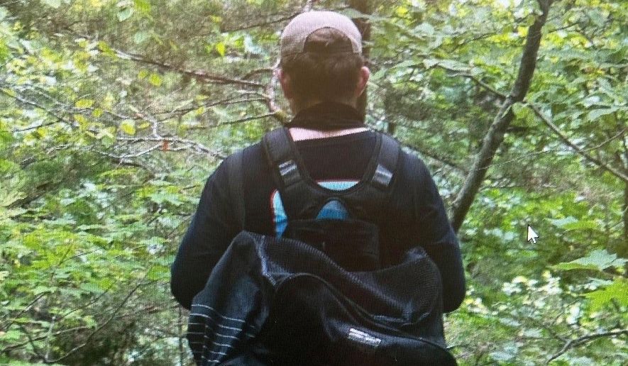 This undated image provided by the Arkansas State Police on July 29, 2025 shows a man whom investigators are asking the public to help identify in connection with a double homicide at Devil's Den State Park. (Arkansas State Police via AP)