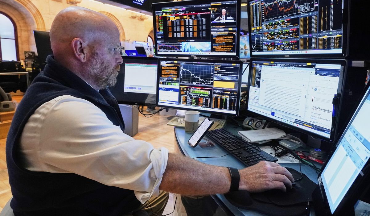 NextImg:Wall Street edges back from its records as its busy week picks up momentum