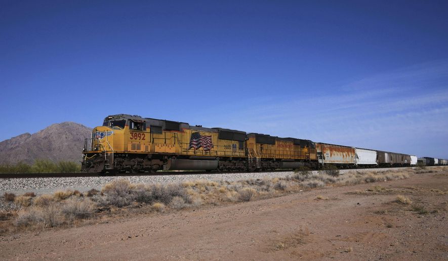 FILE - A Union Pacific freight train travels along the tracks Thursday, April 17, 2025, in Eloy, Ariz. (AP Photo/Ross D. Franklin, File)