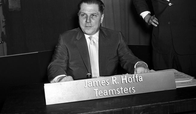 Jimmy Hoffa, president of the Teamsters Union, poses shortly before his appearance on the TV program "Face the Nation" on July 26, 1959, in Washington. (AP Photo) **FILE**