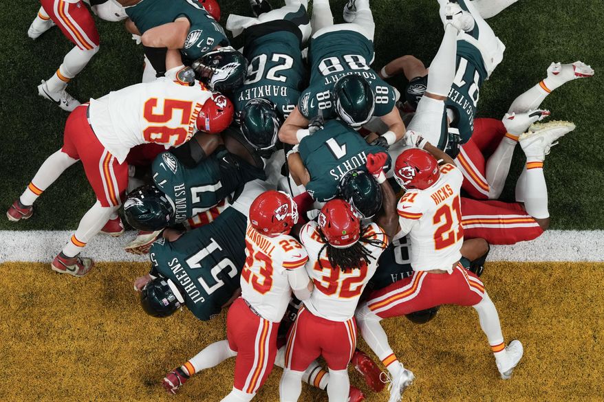 FILE - Philadelphia Eagles quarterback Jalen Hurts (1), with help of the tush push from teammates, scores a touchdown against the Kansas City Chiefs during the first half of the NFL Super Bowl 59 football game, Sunday, Feb. 9, 2025, in New Orleans. (AP Photo/Godofredo A. Vásquez, File)