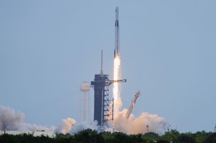 A SpaceX Falcon 9 rocket, carrying a Dragon capsule with a U.S.-Japanese-Russian crew of four, lifts off from Kennedy Space Center's Launch Pad 39-A in Cape Canaveral , Fla., on Friday, Aug. 1, 2025. (AP Photo/Chris O'Meara)
