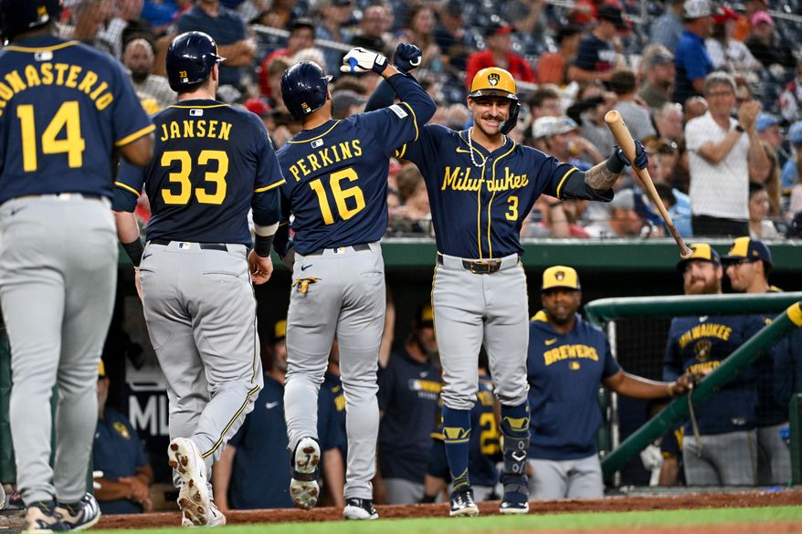 Milwaukee Brewers centerfielder Blake Perkins (16) getting greeted by teammate Joseph Ortiz (3) after hitting his second home run of the game during the fifth inning of an MLB game against the Washington Nationals at Nationals Park in Washington D.C., August 1, 2025. (Photo by All-Pro Reels for Washington Times Sports)