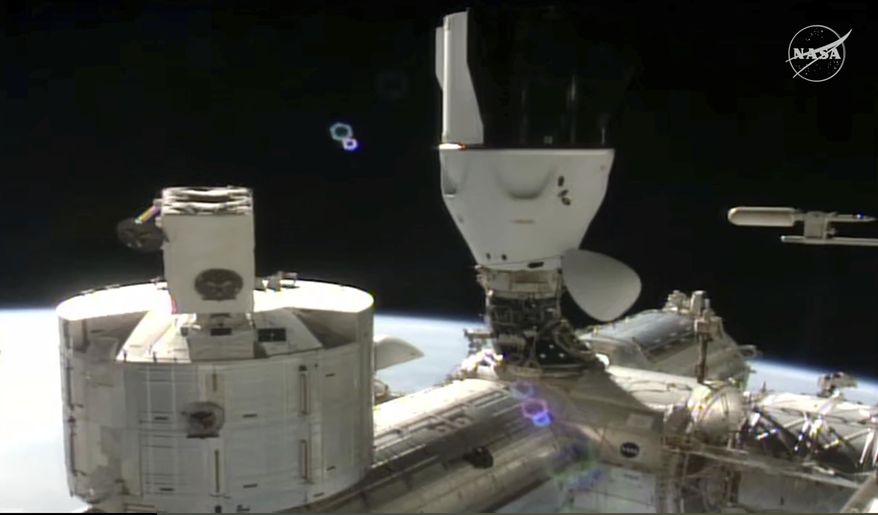 This image made from video provided by NASA and SpaceX shows the docked SpaceX capsule to the International Space Station Saturday Aug. 2, 2025. (NASA and SpaceX via AP)