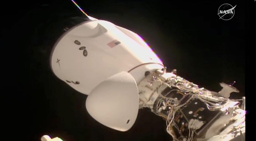 This image made from video provided by NASA and SpaceX shows the docked SpaceX capsule to the International Space Station Saturday Aug. 2, 2025. (NASA and SpaceX via AP)