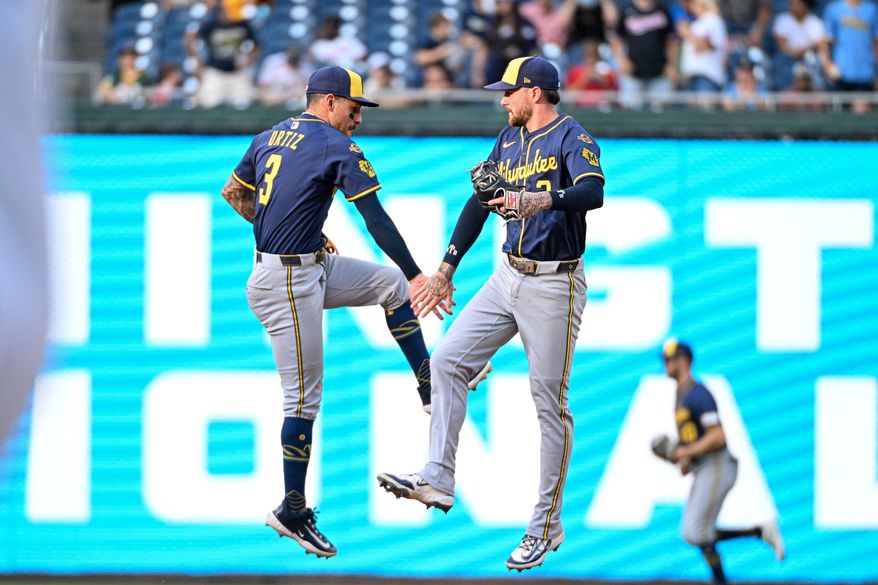 Milwaukee Brewers shortstop Joseph Ortiz (3) slapping hand with second baseman Brice Turang (2) after the team’s 8-2 victory over the Washington Nationals at Nationals Park in Washington D.C., August 2, 2025. (Photo by All-Pro Reels for Washington Times Sports)