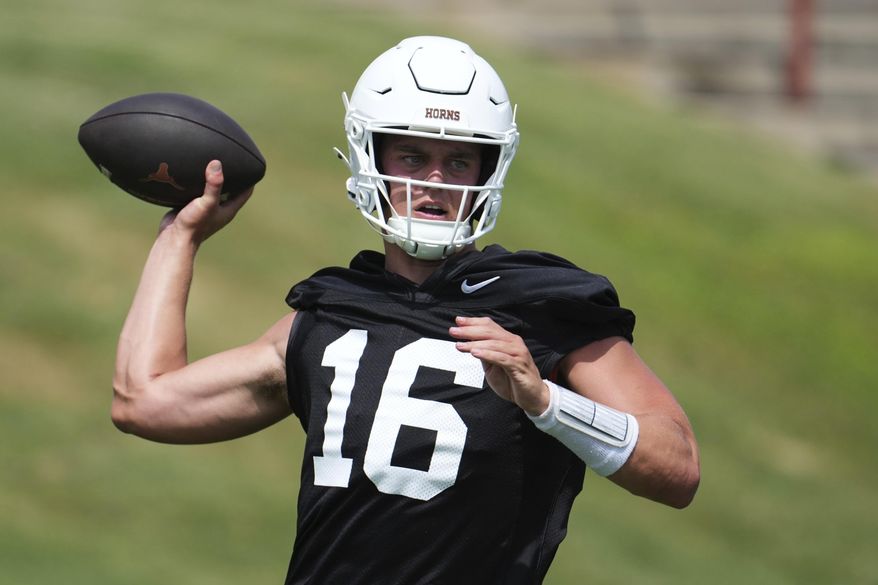 Texas quarterback Arch Manning (16) throws during an NCAA college football practice in Austin, Texas, Wednesday, July 30, 2025. (AP Photo/Eric Gay)