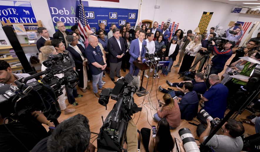 Texas House Democratic Caucus Chair Gene Wu along with other members of the Texas House are joined by Illinois Governor JB Pritzker as they speak about Texas Republican plans to redraw the House map office during a press conference at the Democratic Party of DuPage County office in Carol Stream, IL on Sunday, Aug. 3, 2025. (AP Photo/Mark Black)