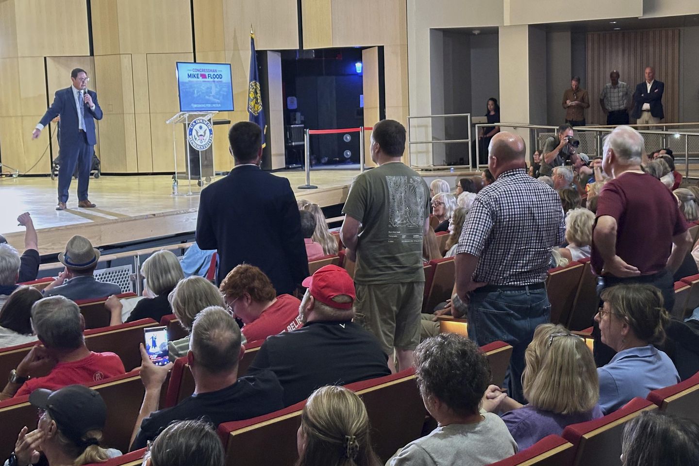 Nebraska Republican is shouted down by hostile crowd at a town hall on Trump's tax cuts
